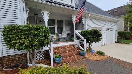 Local porch and exterior work Local home with front porch railing and exterior repair details