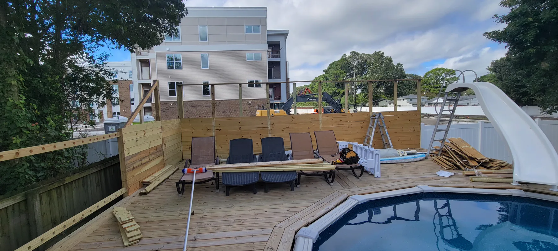 Deck and fence project planning Backyard deck and fence project in progress by A Legacy Handyman