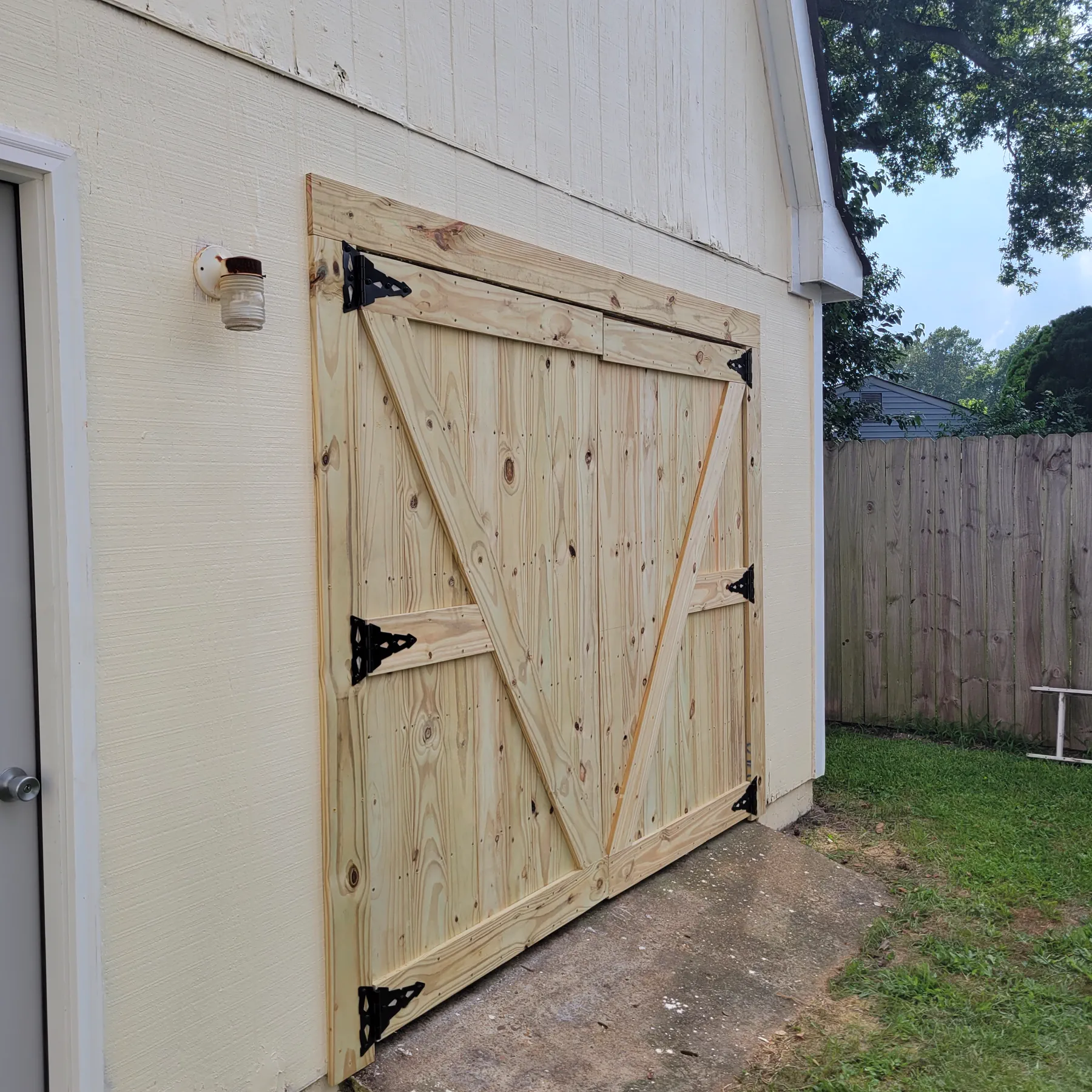 Wood shed door replacement project by A Legacy Handyman