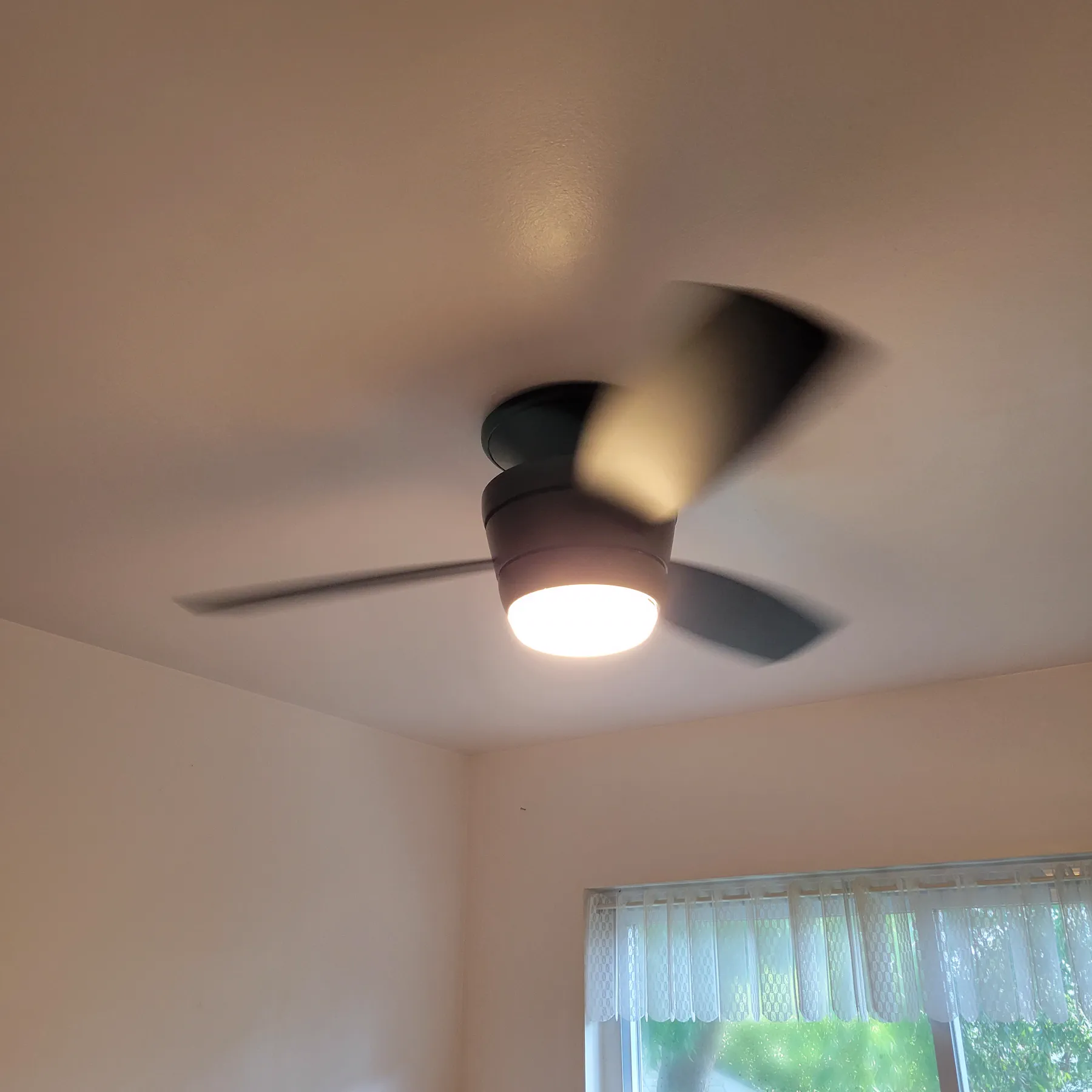Exterior wall light fixture installed on siding